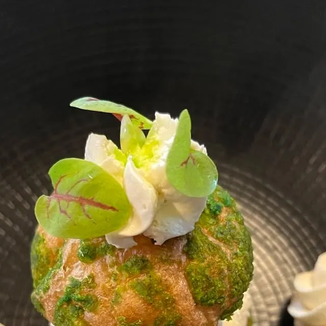 Herb-crusted choux with whipped cream and micro herbs